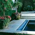 A seamlessly integrated automatic swimming pool cover